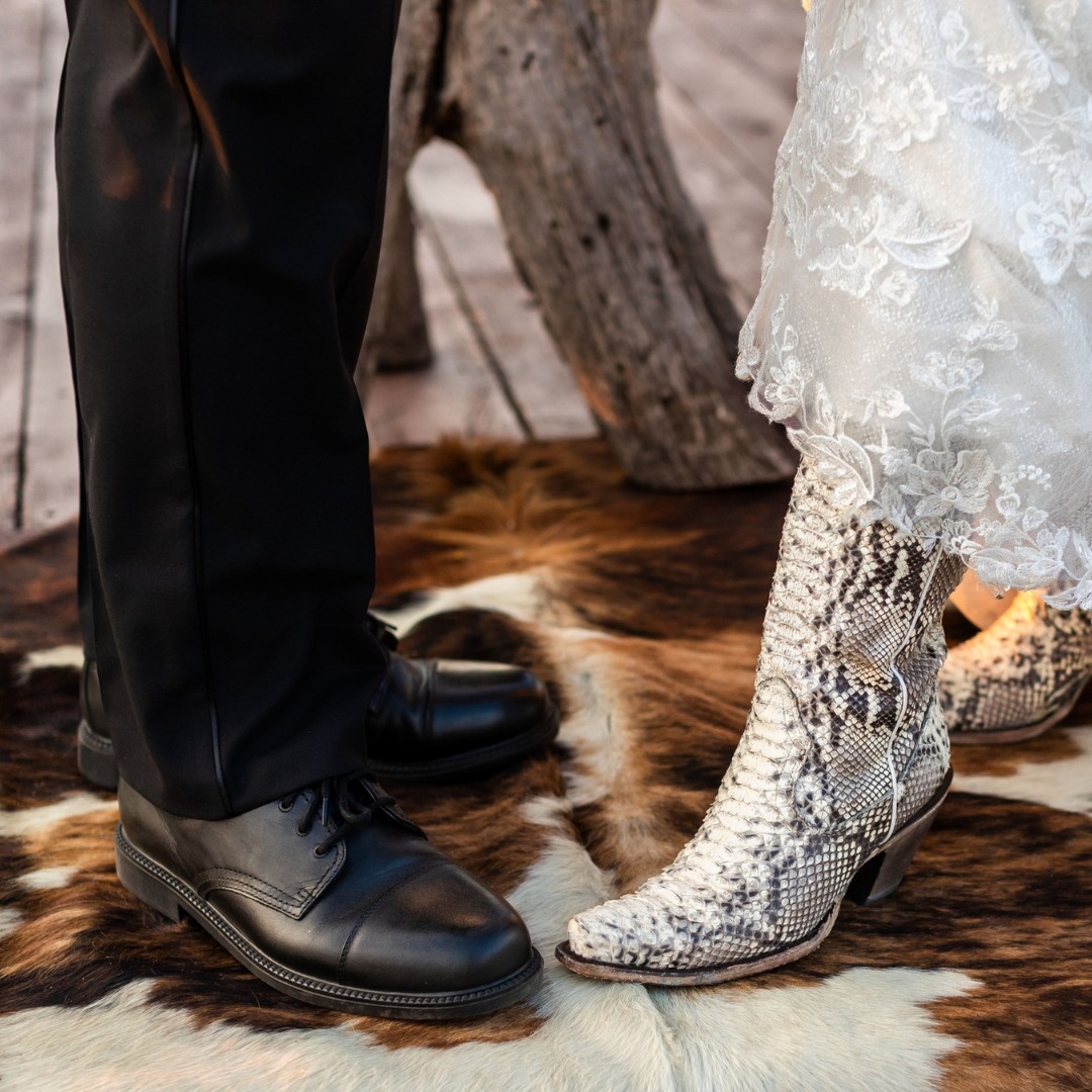 bride showing off snakeskin boots